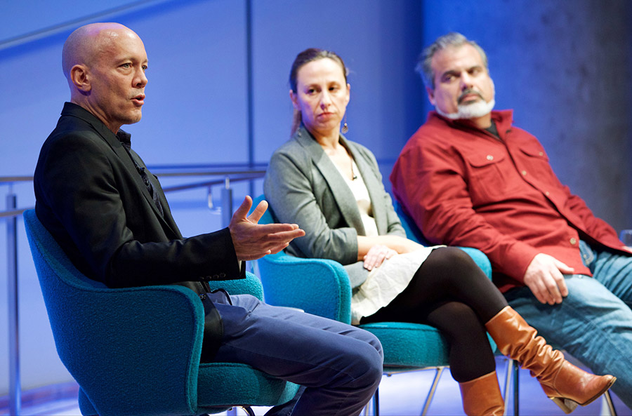 Chris Wink of the Blue Man Group and artists Manju Shandler and Christopher Saucedo sit beside each other onstage as they talk about their artistic responses to 9/11.