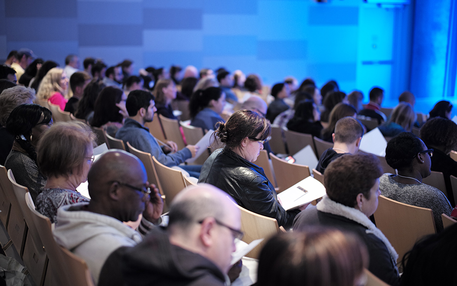 Dozens of educators are seen seated at the Museum’s Auditorium for a conference on New York City area educators.