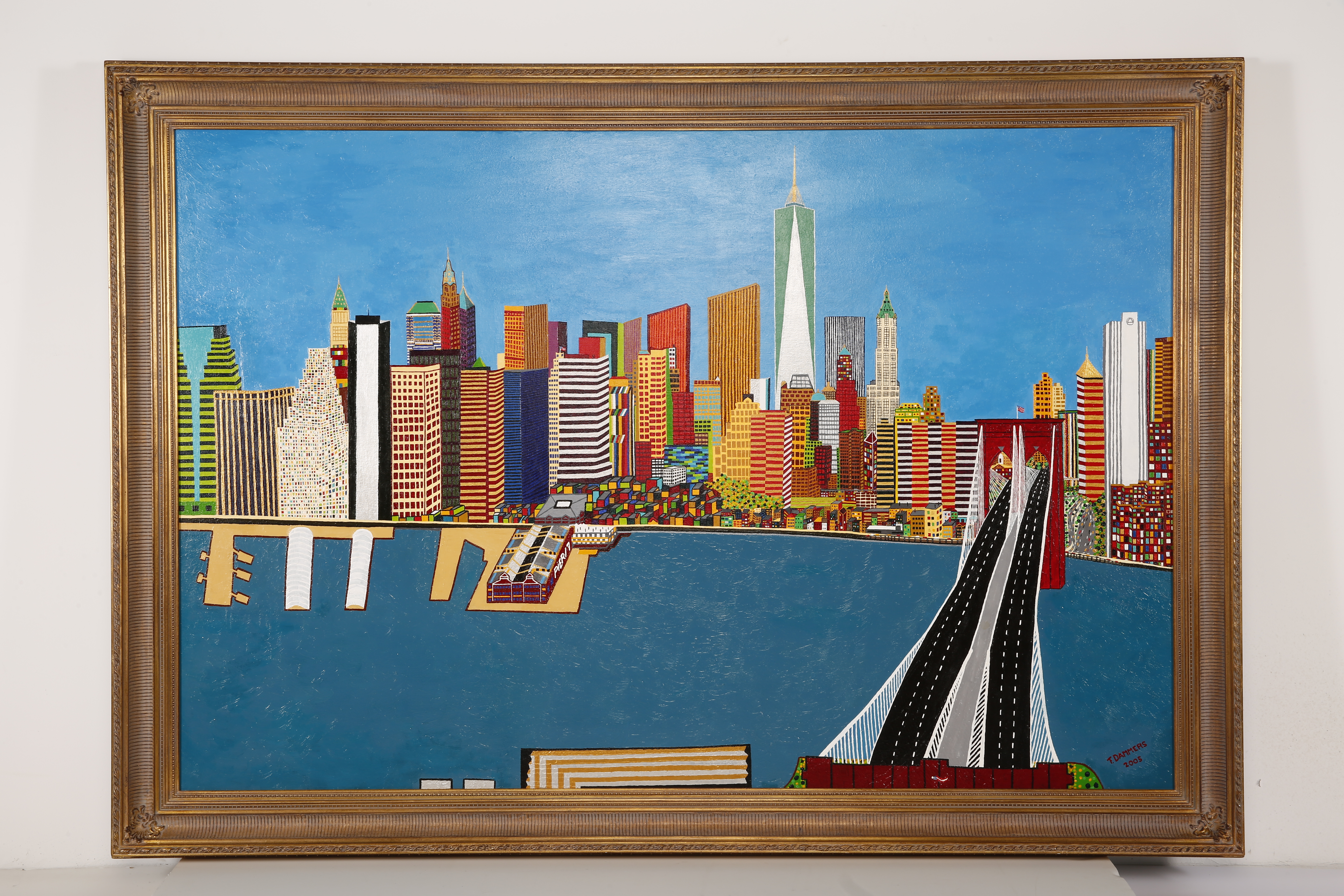 The painting “Freedom New York” by artist Frank Dammers is seen mounted on a wall. The painting depicts lower Manhattan, including Pier 17, the Brooklyn Bridge and One World Trade Center.