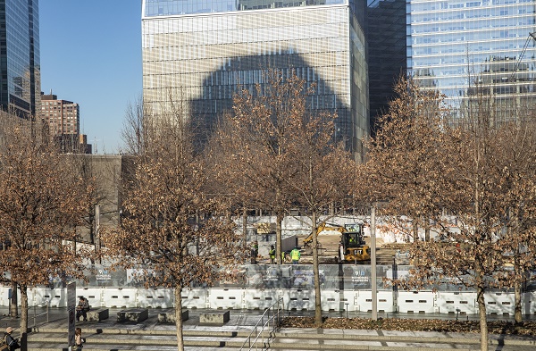 Memorial Glade is seen under construction on Memorial plaza, with a Cat backhoe and other construction materials onsite.