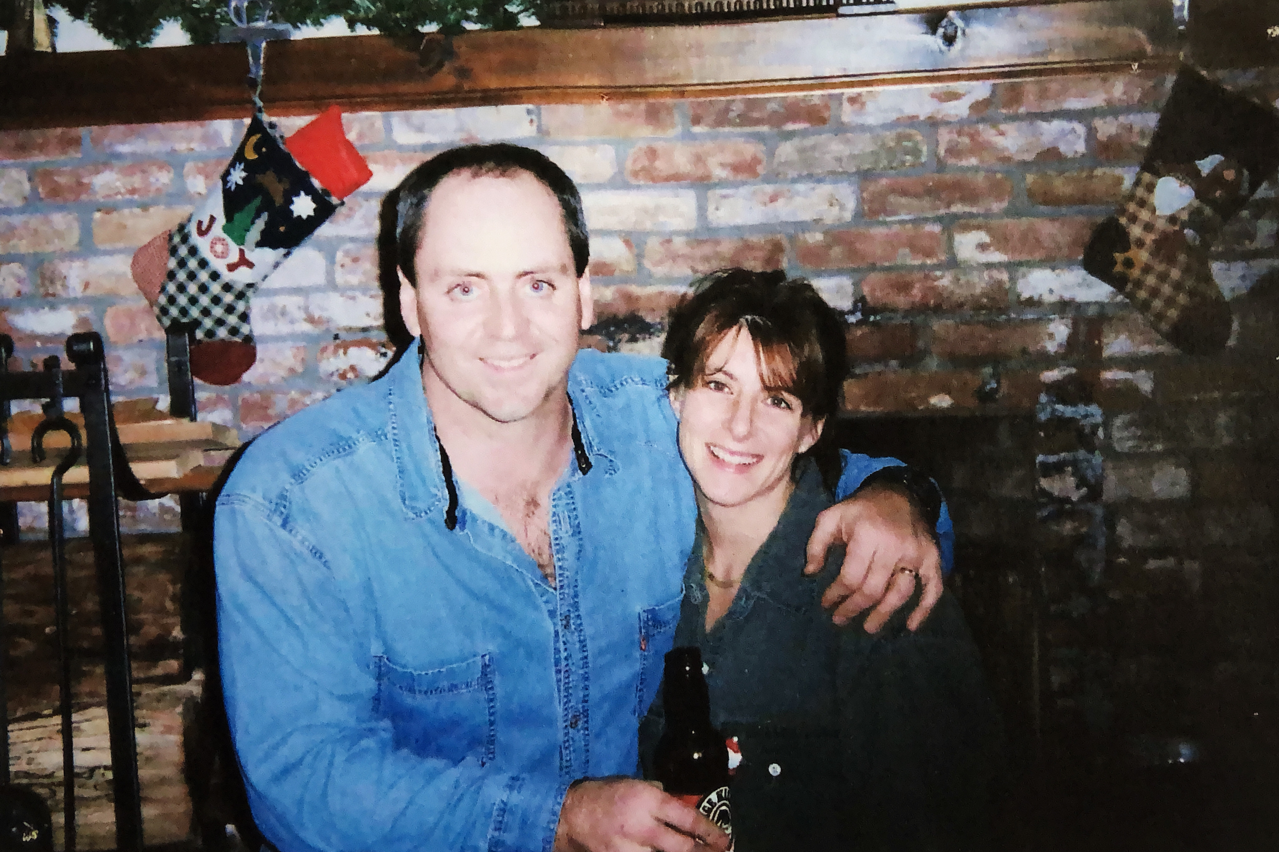 Brian Sweeney and Julie Sweeney Roth smile in an old photo.