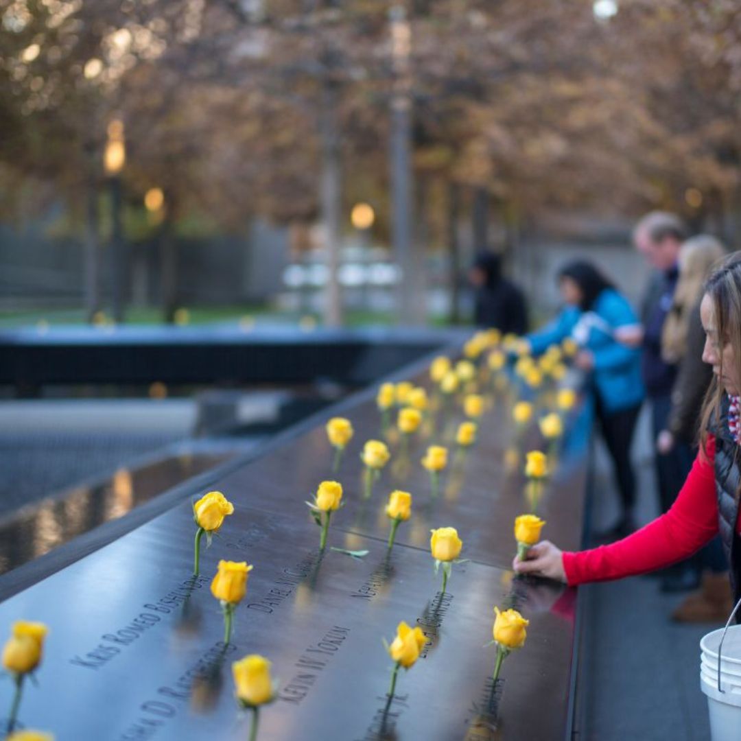 Yellow roses are laid at the Memorial 