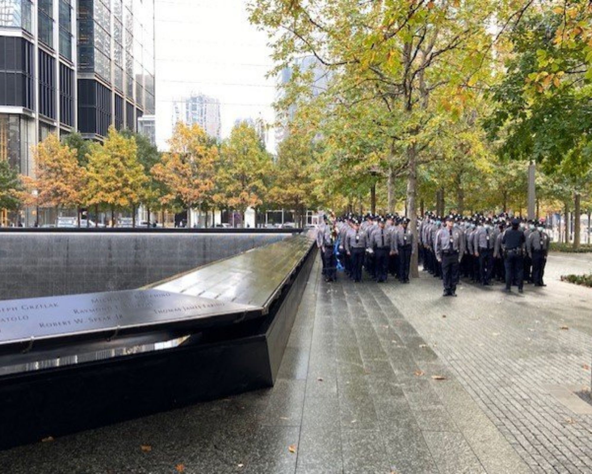 NYPD recruits lined up across the Memorial pool 