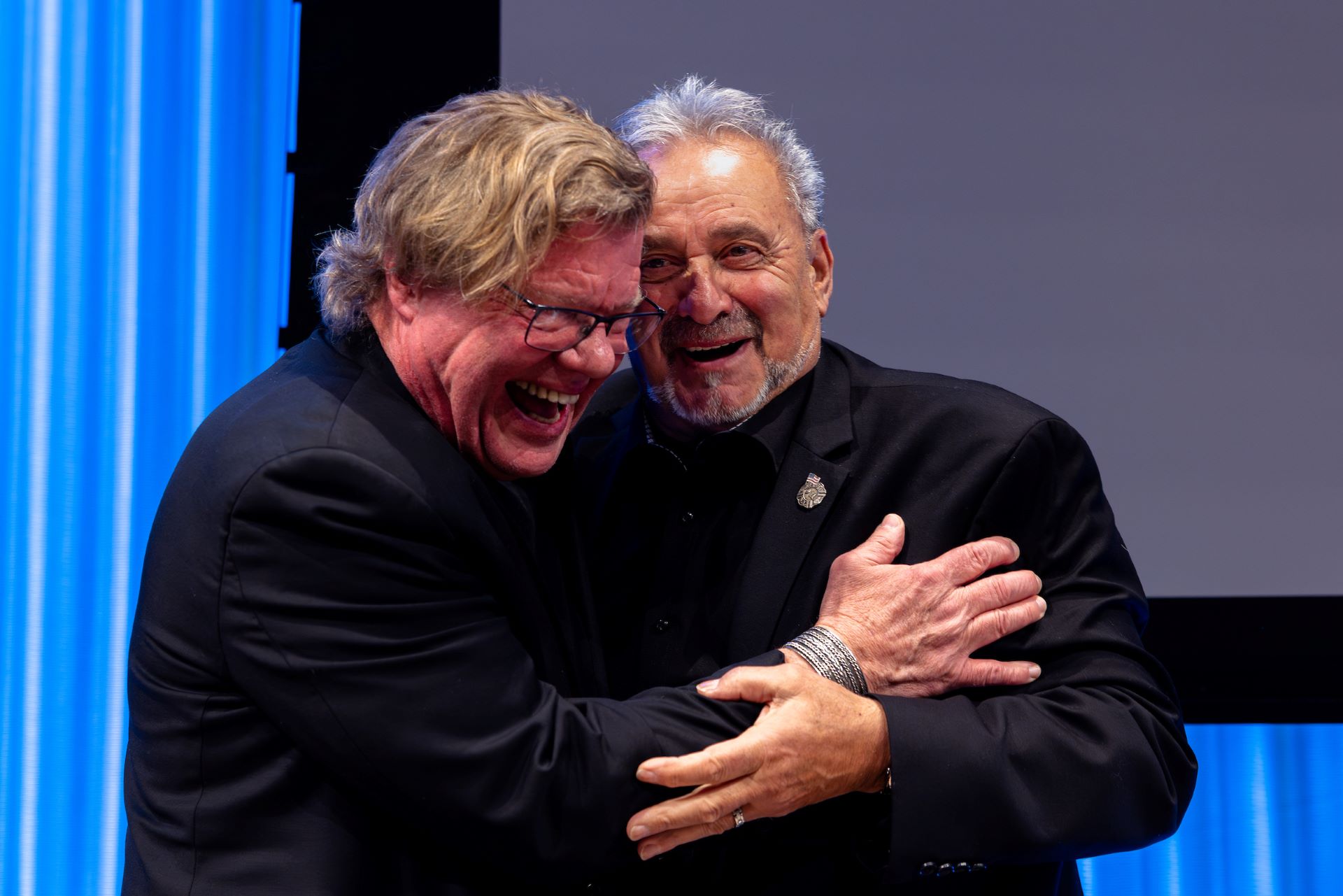 Joe McNally hugs Louie, the man on the cover of his book, "Faces of Ground Zero"