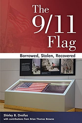 Book cover shows American flag in white and glass museum display case