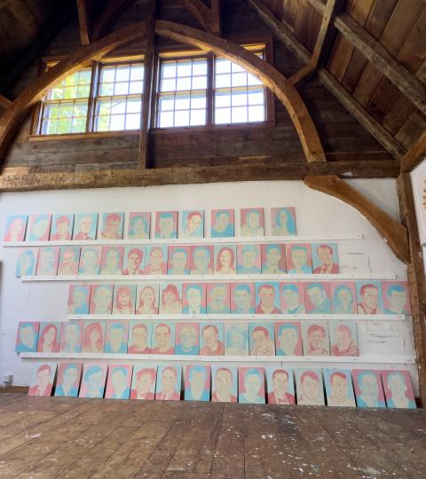 An image of all 67 Portraits hanging together in Katie Ré Scheidt's studio in Roxbury, CT, where they were painted.