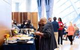 Veteran service organizations gather in the Museum Atrium for a Thank You Breakfast. 