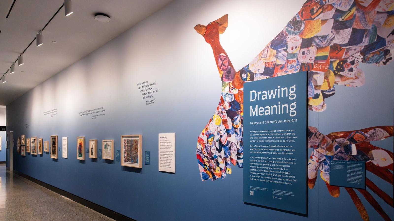 Drawing Meaning Art Wall - photos are visible beside the poster describing the exhibition