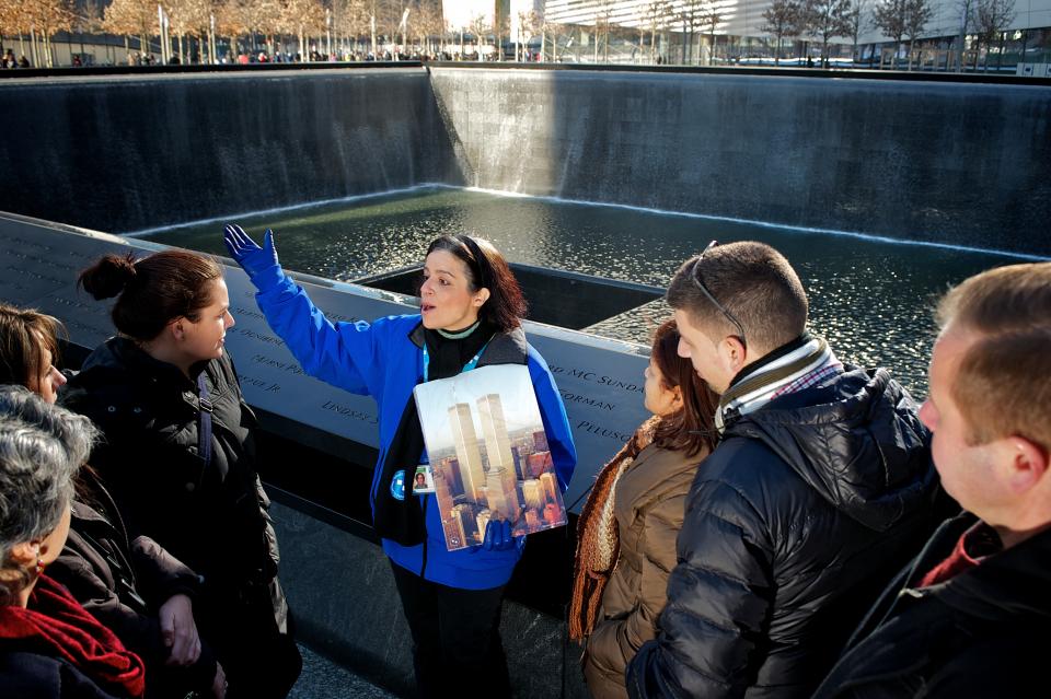 A Tribute WTC docent leads a guided walking tour of the 9/11 Memorial (Gary Cirlin photo; courtesy of Tribute WTC) TributeWTC.jpg