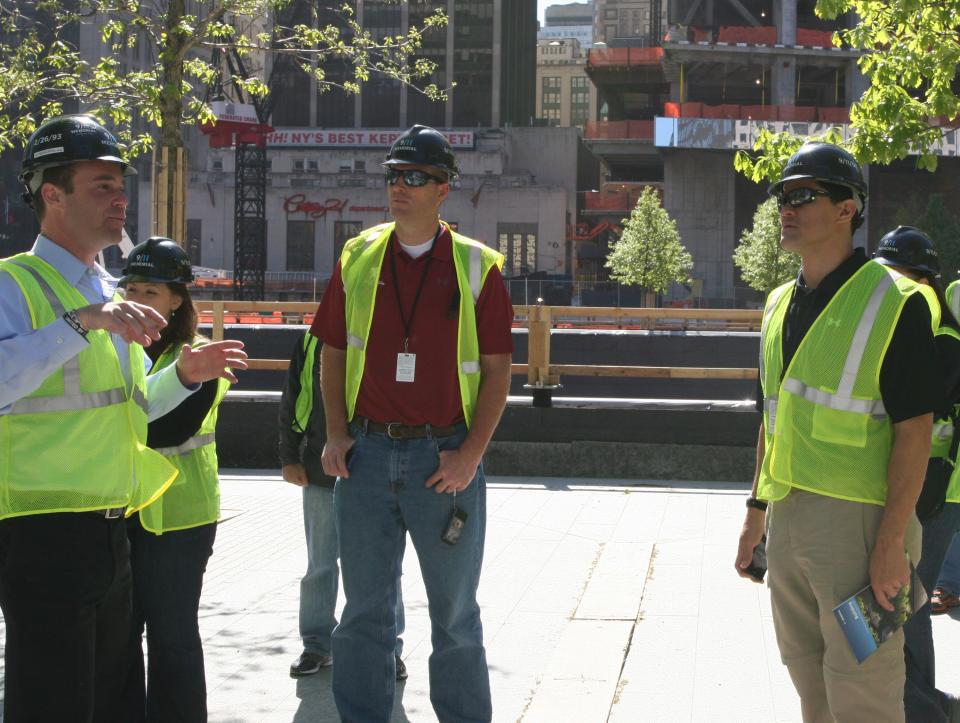 From left to right, 9/11 Memorial President Joe Daniels presents the "Survivor Tree" to former NFL players Chad Lewis and Tedy Bruschi. WoundedWarriors.jpg